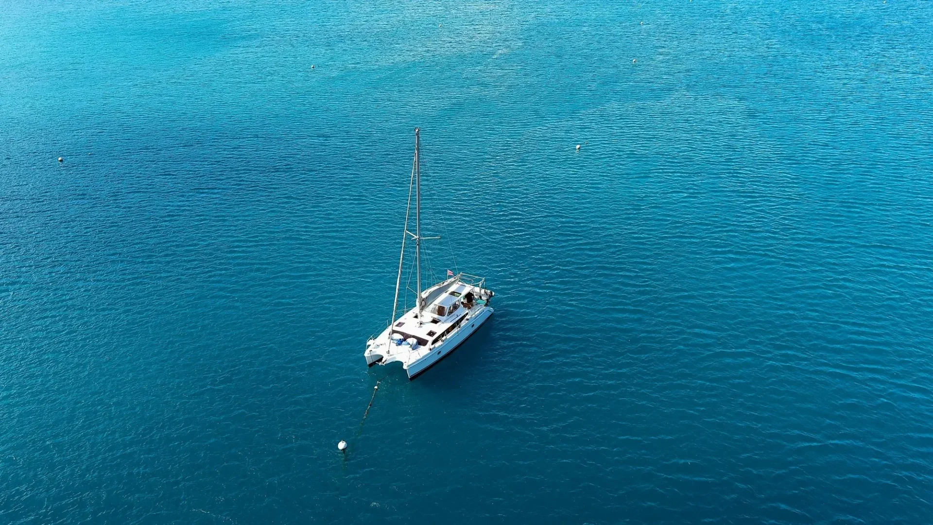 Full Day Aboard Sailing Catamaran SY Mazu or SY Neptune